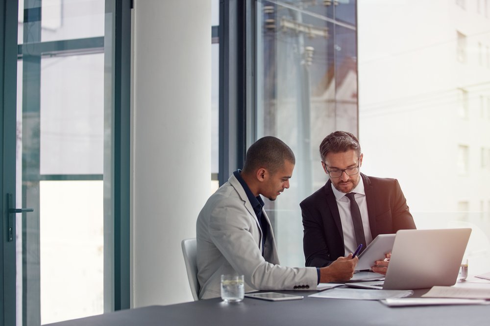 business people talking laptop