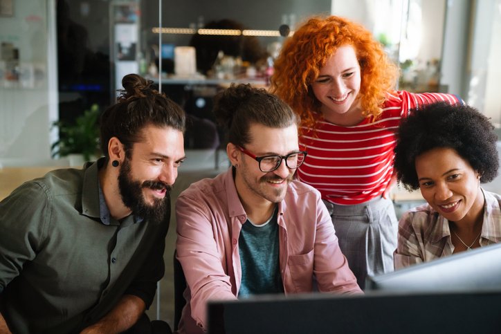 business professionals at computer - casual_istockphoto-2156189410